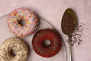 Decorative Desserts Drucke: Assorted donuts with icing and spoon with sugar sprinkles