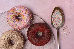 Decorative Donuts Drucke: Assorted donuts with icing and spoon with sugar sprinkles