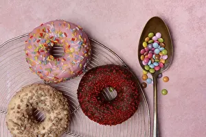 Assorted Donuts Drucke: Assorted donuts with icing and spoon with sugar sprinkles