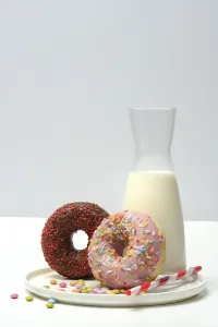 Donut Photography Drucke: Assorted donuts and jar with milk