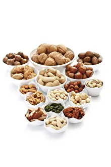 Close Up Nuts Drucke: Assorted nuts and kernels in ceramic bowls