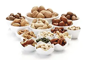 Assorted Nuts Drucke: Assorted nuts and kernels in ceramic bowls