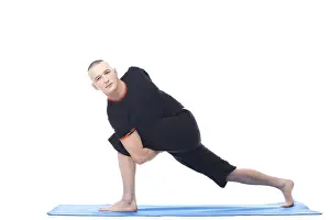 Meditation And Wellbeing Drucke: Attractive man posing in difficult yoga position