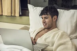 Young Man Working Drucke: Attractive Young Man with Serious Expression