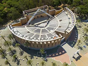 Spanish Historic Landmark Drucke: An auditorium surrounded by trees and palm trees