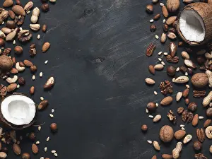 Dark Background Copy Space Drucke: Background of mixed nuts - coconut