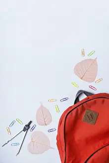 Blue Background Image Drucke: Backpack and school subjects on a blue background
