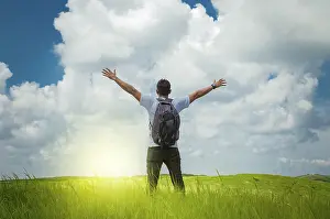 Agriculture Landscape Photo Drucke: Backpacker man in the field spreading his hands