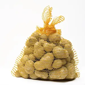 Deserted Grocery Store Scene Drucke: Bag of potatoes on white background