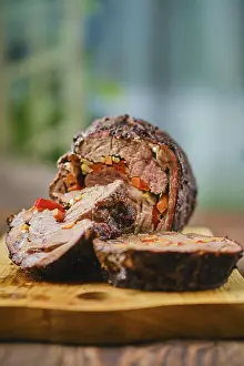 Barbecue Dish Drucke: Baked beef roll with vegetables (focus on foreground)