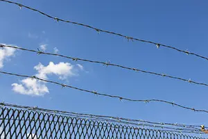 Blue Sky Southern Germany Drucke: Barbed wire in front of a blue sky