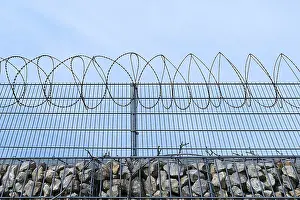 Central Europe Border Station Drucke: Barbed wire secured stone wall, Germany