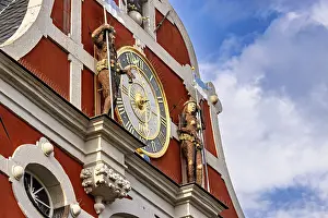 Baroque Facade Drucke: Baroque facade with clock and figures under a blue sky with clouds