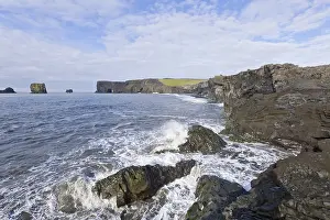 Rocky Coastline Photos Drucke: Basalt cliffs and a rock arch on the coast