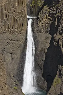 Atlantic Ocean Waterfalls Drucke: Basalt columns lining Litlanesfoss Waterfall