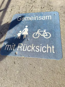 European Street Scene Drucke: Base plate on shared footpath cycle path with inscription Together with consideration