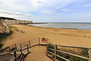 British Coastline Drucke: Bay with sandy beach, cliff with rock gate