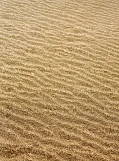 Uninhabited Coastal Landscape Drucke: Beach sand waves warm texture pattern background