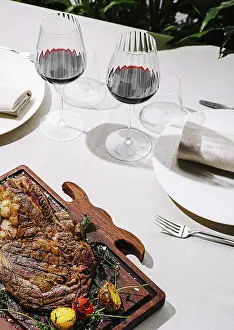 Steak Meal Ideas Drucke: A beautifully arranged dinner table features a large
