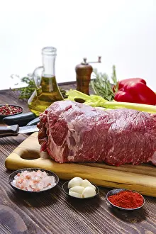 Raw Meat Photography Drucke: Beef fillet with vegetables on kitchen table