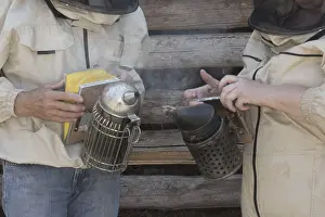 Wild Bee Conservation Drucke: Beekeeper at work at the beehive