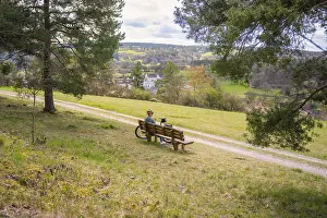 Electric Bicycle Ride Drucke: A bench with a bicycle in front of it
