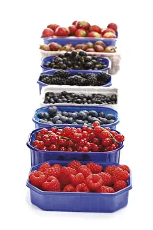 Studio Shot Of Berries Drucke: Berries in plastic boxes, raspberries