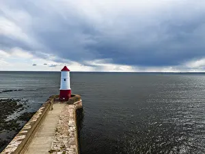 Top Down View Of Pier Drucke: Berwick Pier and Lighthouse from a drone