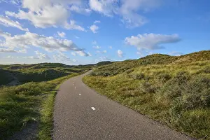 Cloudy Sky Netherlands Drucke: Bicycle path, sand dune, clouds