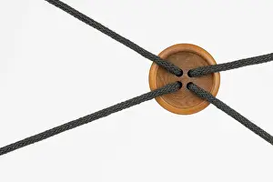 Deserted Fortification Drucke: Big clothing button with ropes as conceptual node