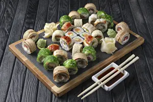 Seafood Dishes Drucke: Big set of rolls served on stone plate