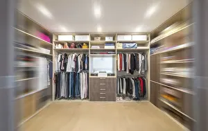 Blurred Motion Photography Drucke: Big wardrobe with different clothes for dressing room