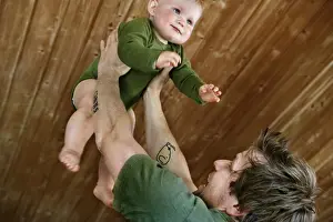 Family Leisure Time Drucke: Blond boy with his father