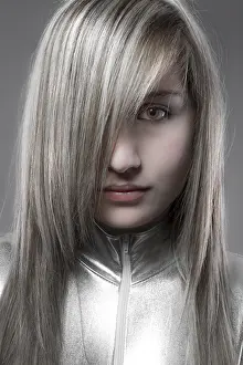 Blonde Woman Looking At Camera Drucke: Serious blond, concept future and modernity