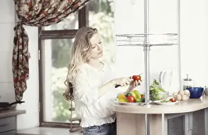 Easy Breakfast Ideas Drucke: Blond lady at kitchen preparing vegetable for breakfast