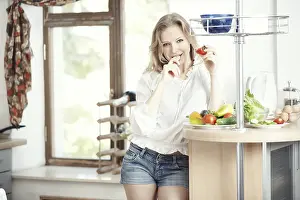 Kitchen Vegetable Prep Drucke: Blond lady at kitchen preparing vegetable for breakfast