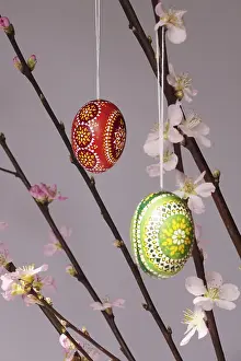 Decorative Easter Eggs Drucke: Blooming branches of a peach tree in a vase decorated with Easter eggs