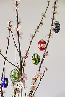 Central Europe Spring Scene Drucke: Blooming branches of a peach tree in a vase decorated with Easter eggs