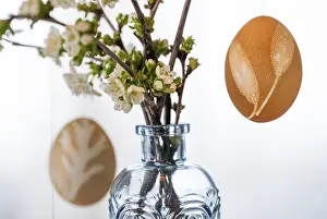 Blue And White Blossoms Drucke: Blown out Easter eggs, in the background a light blue vase with blossoming branches