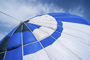 Hot Air Balloon Ride Drucke: Blue Balloon in the blue cloudy sky
