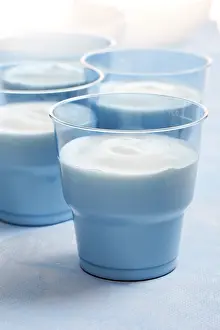 Eating Healthy Habits Drucke: Four blue cups of yoghurt