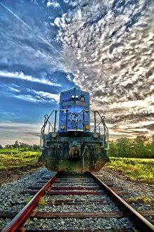 Sunrise Rail Traffic Drucke: Blue freight train engine at sunrise