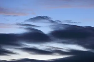 Cloudy Sky Overcast Drucke: Blue sky with dramatic dark clouds at dusk