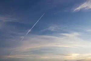 Cloudy Weather Forecast Drucke: Blue sunset sky with trace of the plane