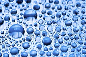 Abstract Rainy Scene Drucke: Blue water drops background close up