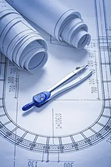 Blueprint Rolls Concept Drucke: Blueprint rolls and pair of compasses construction concept