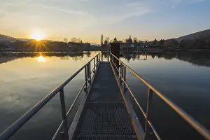 Evening Atmosphere In Bavaria Drucke: Boat Dock on the River at Sunset
