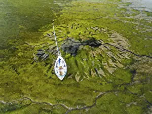 UK Defence Facility Image Drucke: Top Down over boat and mud from drone