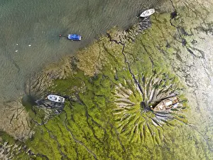 Historic Fortification In England Drucke: Top Down over boat and mud from drone