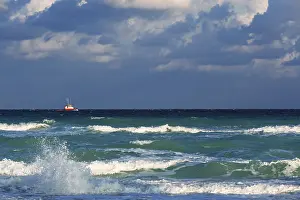 Gloomy Cloudy Sky Drucke: Boat in the sea amid a thundercloud